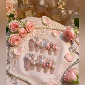 Elegant Pink Nail Coffin Set With Blinged Accents